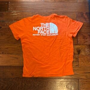 Orange north face shirt